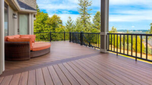 Deck overlooking view of trees and blue sky